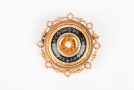 A 19th century circular gold coloured metal target broochsurrounded by split pearls and black