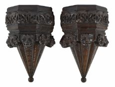 A pair of carved oak wall bracketspossibly late 17th century/early 18th centurythe upper tier