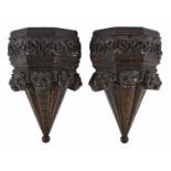 A pair of carved oak wall brackets
possibly late 17th century/early 18th century
the upper tier