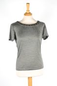 Five ladies designer blousesthe first a Christian Dior pale grey blouse with beading to collar, the