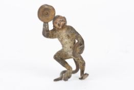 An early 20th century Austrian cold painted bronze monkeystood in a dancing pose holding cymbals,