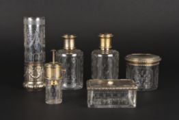 A fine quality late 19th century silver gilt and engraved glass dressing table setContinental,