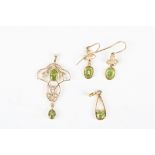 An Edwardian style 9ct gold, seed pearl and peridot pendant and earrings the pendant of scrolled