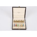 A set of six Norwegian silver gilt and enamel spoons
in a fitted case, retailed by Birger Olberg,