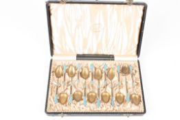 A set of twelve silver gilt and enamel coffee spoons by David Andersen, Stockholmthe stems with
