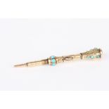 A gold coloured metal propelling pencil
with mounted turquoise stones and amethyst, suspension