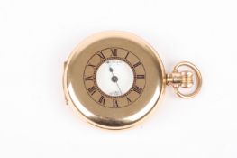 A 9ct gold half hunter pocket watch the enamel dial with Roman numerals inscribed Waltham USA, with