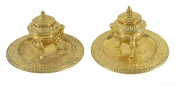 A pair of ornate gilt brass inkwellscirca 1880each with foliate cast well with three mounted