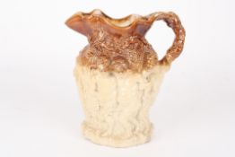 A rare Stephen Green of Lambeth saltglaze stoneware jugc.1830-1840, relief moulded with cherubs