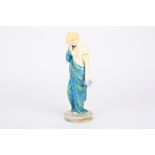 A Royal Worcester porcelain figure 'Sorrow' by James Hadley
formed as a young semi-nude woman in a