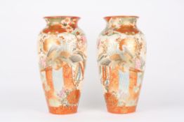 A large pair of early 20th century Japanese Imari vases, each decorated with Asiatic pheasants,