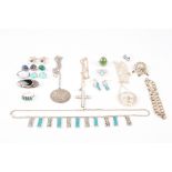 A collection of assorted silver jewellery
16 pieces, including necklaces,  brooches, rings and