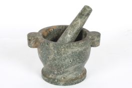 A large granite pestle and mortarwith carrying handlesDimensions: height 18cm., diameter