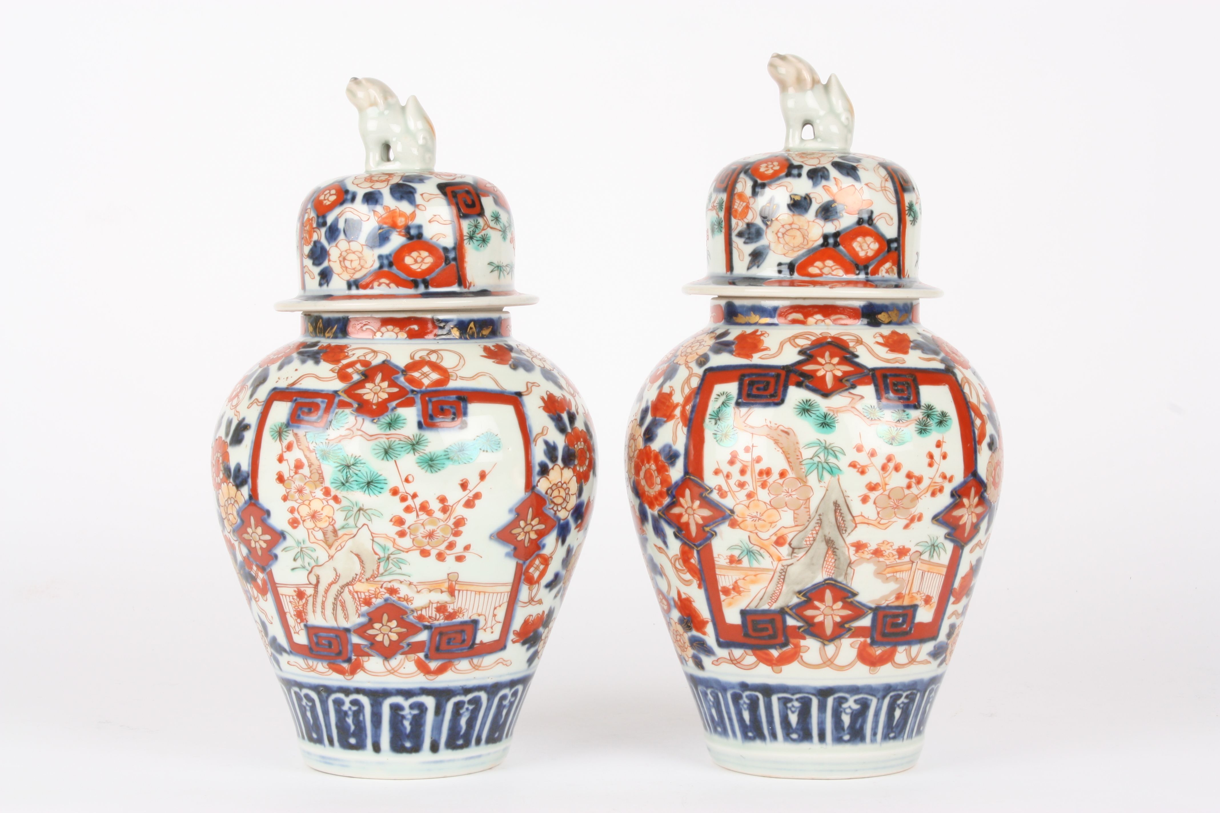 A pair of late 19th century Japanese Imari vases and covers
the lids crested with dogs of foe, the - Image 2 of 4