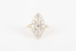 A gold coloured metal marquise shaped diamond cluster ring set with numerous diamonds and diamond