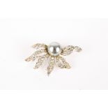 A Christian Dior floral brooch by Mitchel Maer
set with simulated black pearl, surrounded by