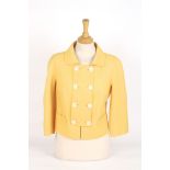 A canary yellow Christian Dior wool jacket
double breasted, two faux pockets to the front, eight