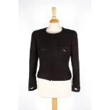 A brown Chanel wool jacket
with zip to front and two pockets to breast, with cut out patterns with