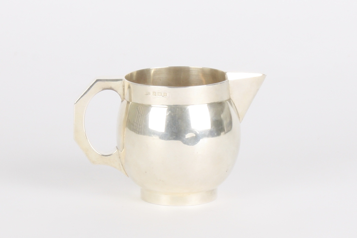 A George V globular silver cream jug
hallmarked Birmingham 1912, of plain form with sparrow beak - Image 2 of 2