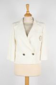 A Chanel ivory jacketdouble breasted with gold coloured swirl patterned buttons, embroidered logo