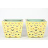 A large pair of Chinese yellow ground rectangular trough planters
the tapered bodies decorated all