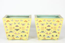 A large pair of Chinese yellow ground rectangular trough plantersthe tapered bodies decorated all