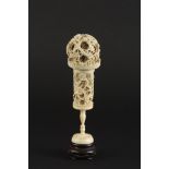 A Chinese ivory puzzle ball
late 19th/early 20th century
deeply carved with dragons, raised on