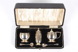 A George V silver cruet sethallmarked Birmingham 1937, in a fitted case with blue glass liners,