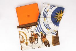 Two Hermès scarves, one in original boxthe first predominantly navy and gold depicting signs of the