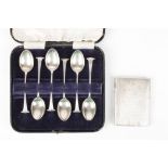 A cased set of six silver tea spoons
hallmarked Sheffield 1960, together with an engine turned