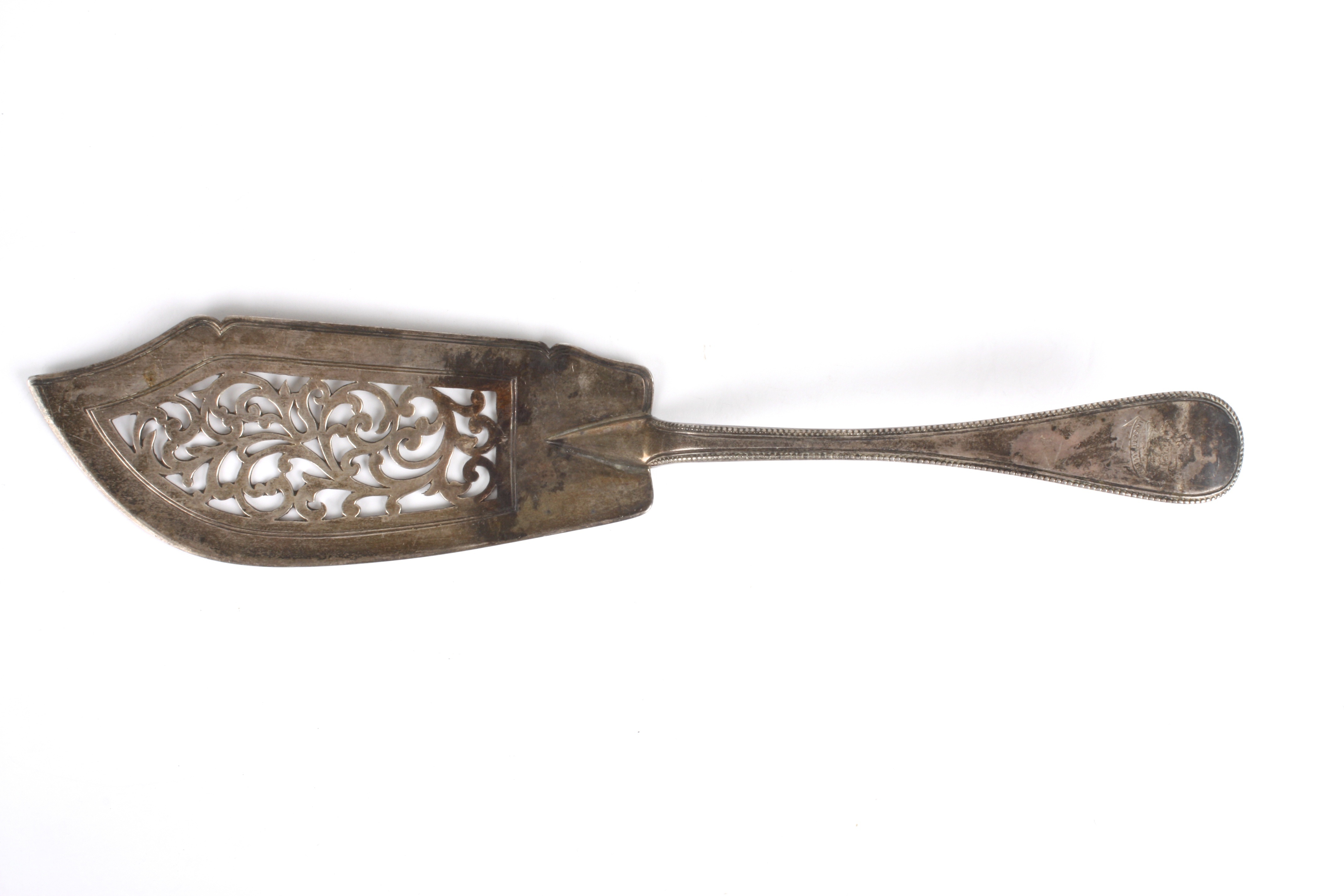 A Victorian Old English pattern silver fish slice
hallmarked 1857, with threaded, pierced and