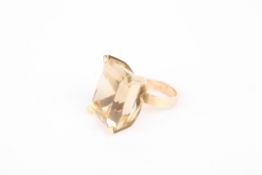 A large 14K gold and citrine dress ringthe faceted citrine of oblong form Dimensions: The citrine