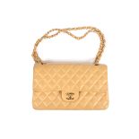A leather quilted camel coloured Chanel bag
the leather double flap bag from Chanel featuring a