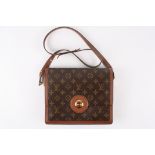 A Louis Vuitton Raspail shoulder bag
with monogram canvas and treated cowhide leather trim. One