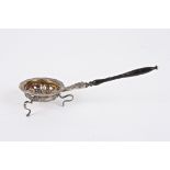 A 19th century Russian silver strainer marked Faberge
with floral mounted rim, turned wooden