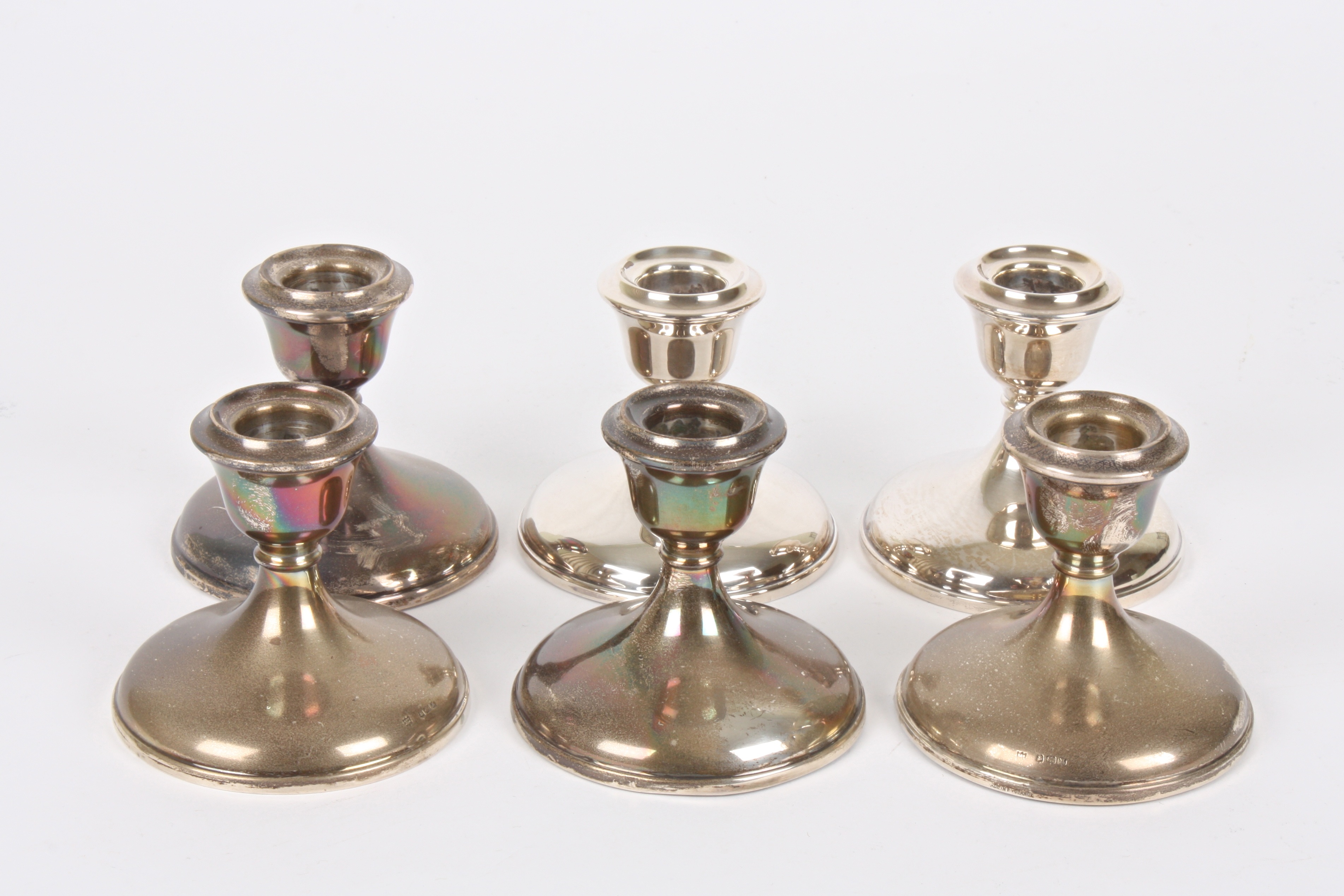 A set of six George VI small silver candlesticks
hallmarked Birmingham 1947, of circular form with