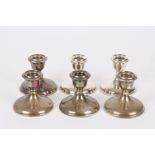 A set of six George VI small silver candlesticks
hallmarked Birmingham 1947, of circular form with