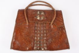 Brown alligator/crocodile skin bag.With two sections inside.Dimensions: Condition reportFair