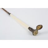 A 19th century riding crop with white metal vinaigrette
with ivory upper section surmounted by white