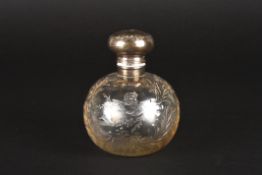 A Victorian silver and cut glass scent bottlehallmarked Birmingham 1898, the silver top decorated