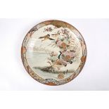 A large early 20th century Japanese Imari charger
decorated with a scene of geese in flight and