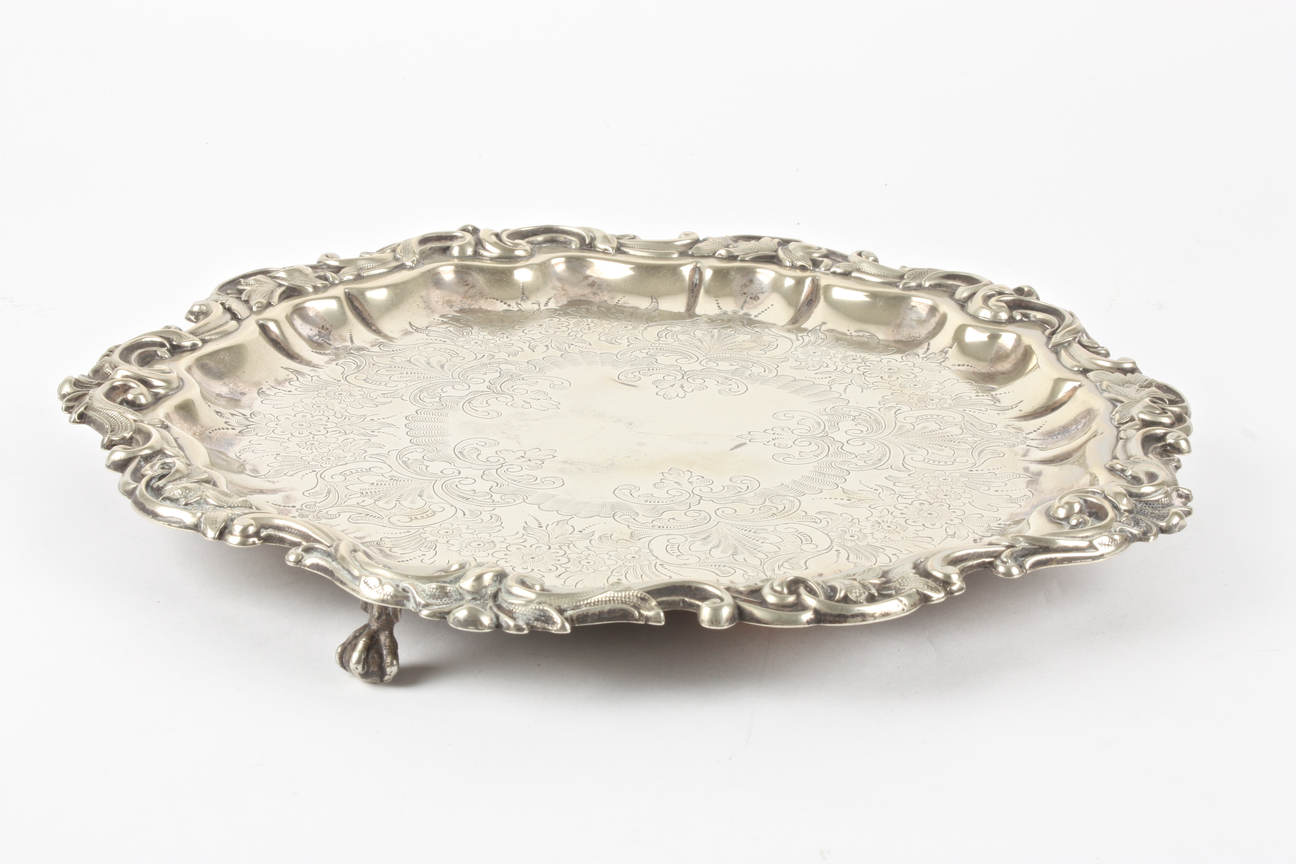 A silver plated tray
of pie-crust form, decorated with scrolls and foliageDimensions: diameter - Image 2 of 3