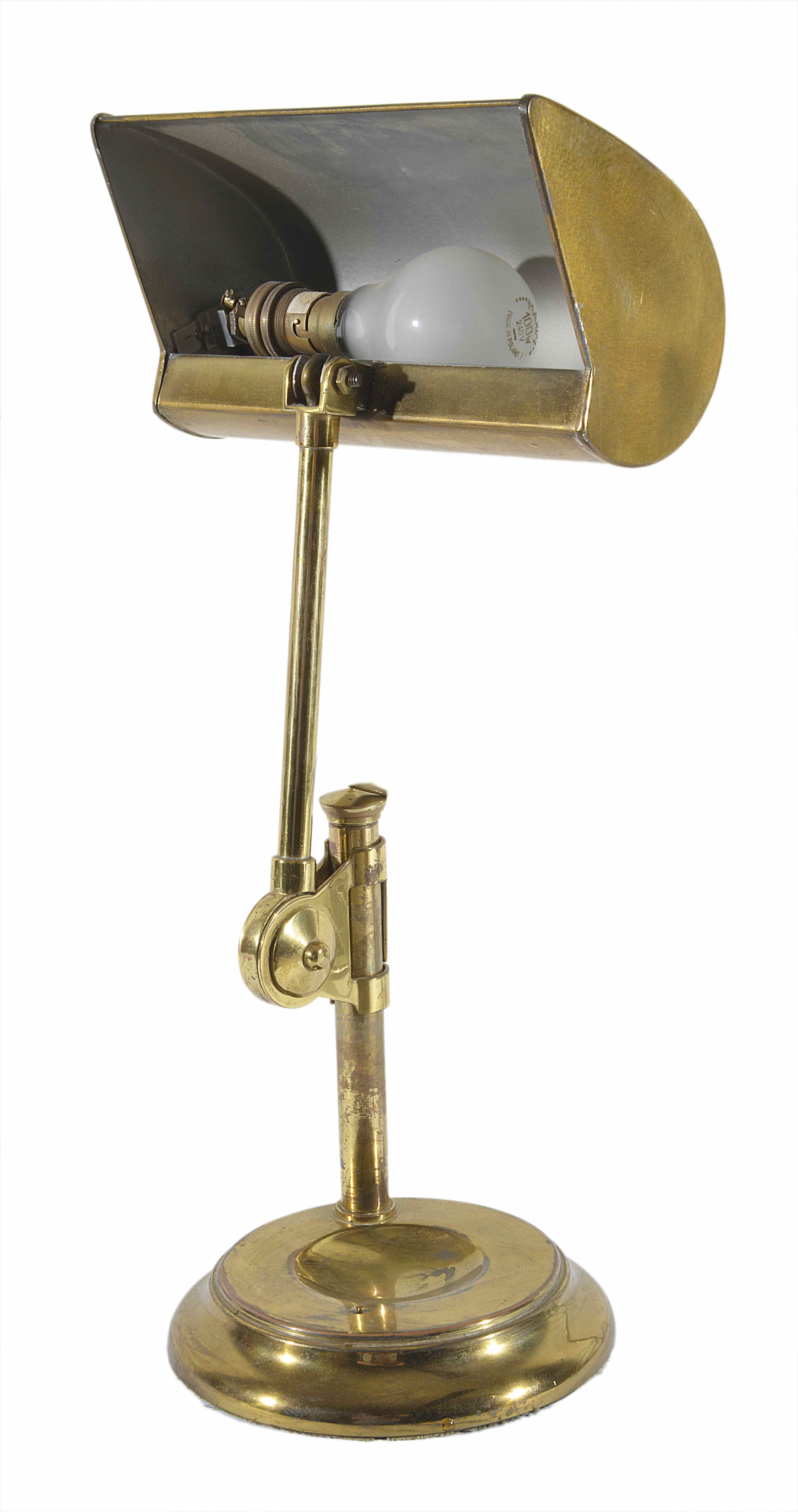 An adjustable brass desk lamp
on a circular baseDimensions: height 45cmCondition reportA little