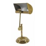 An adjustable brass desk lamp
on a circular baseDimensions: height 45cmCondition reportA little