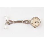 An 18ct white gold nurses fob watch
the silvered dial, surrounded by a diamond chip bezel and