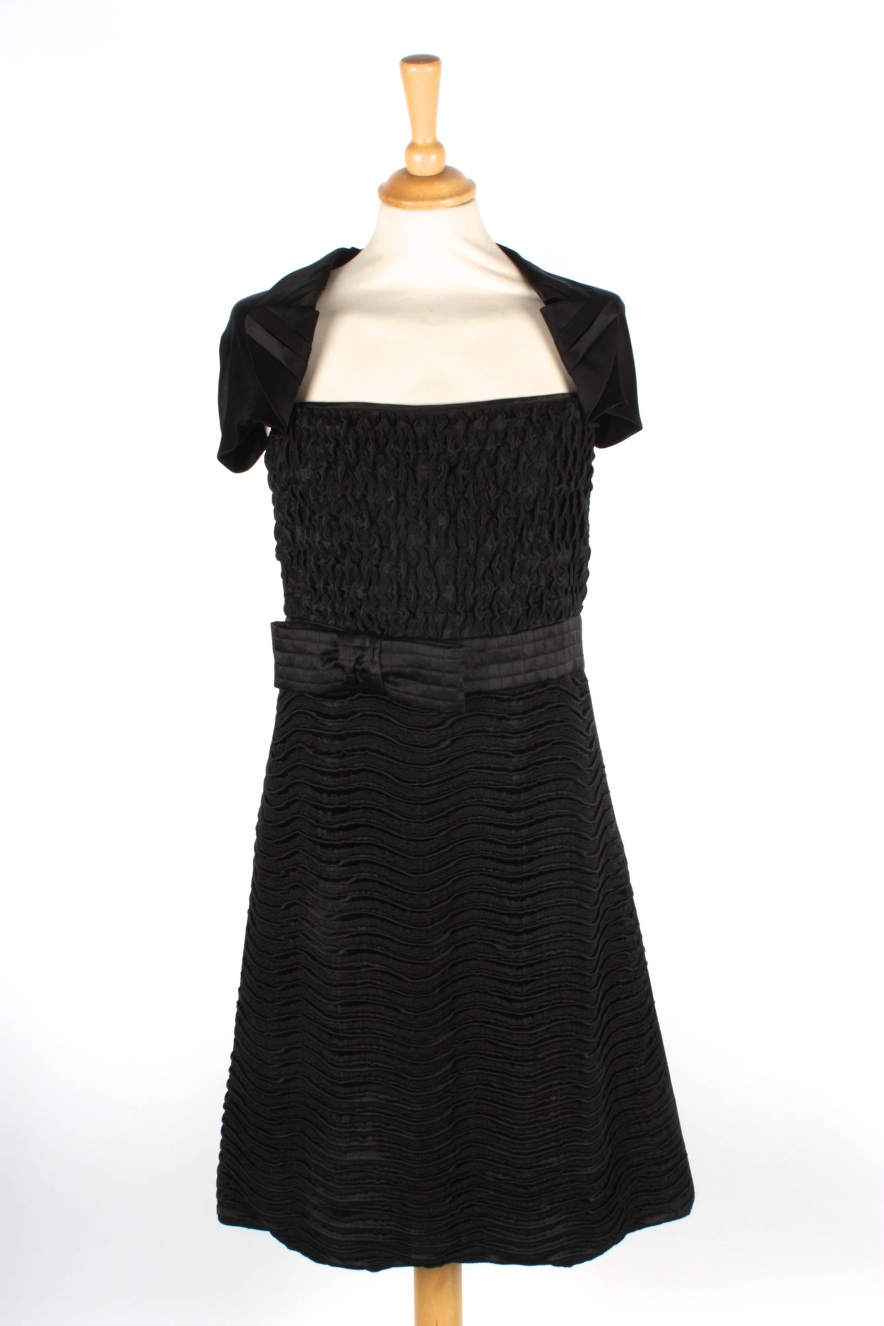A black silk Prada evening dress
with ruche top, bow to side, decorative cap sleeves and ruche skirt