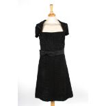 A black silk Prada evening dress
with ruche top, bow to side, decorative cap sleeves and ruche skirt