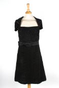 A black silk Prada evening dresswith ruche top, bow to side, decorative cap sleeves and ruche skirt