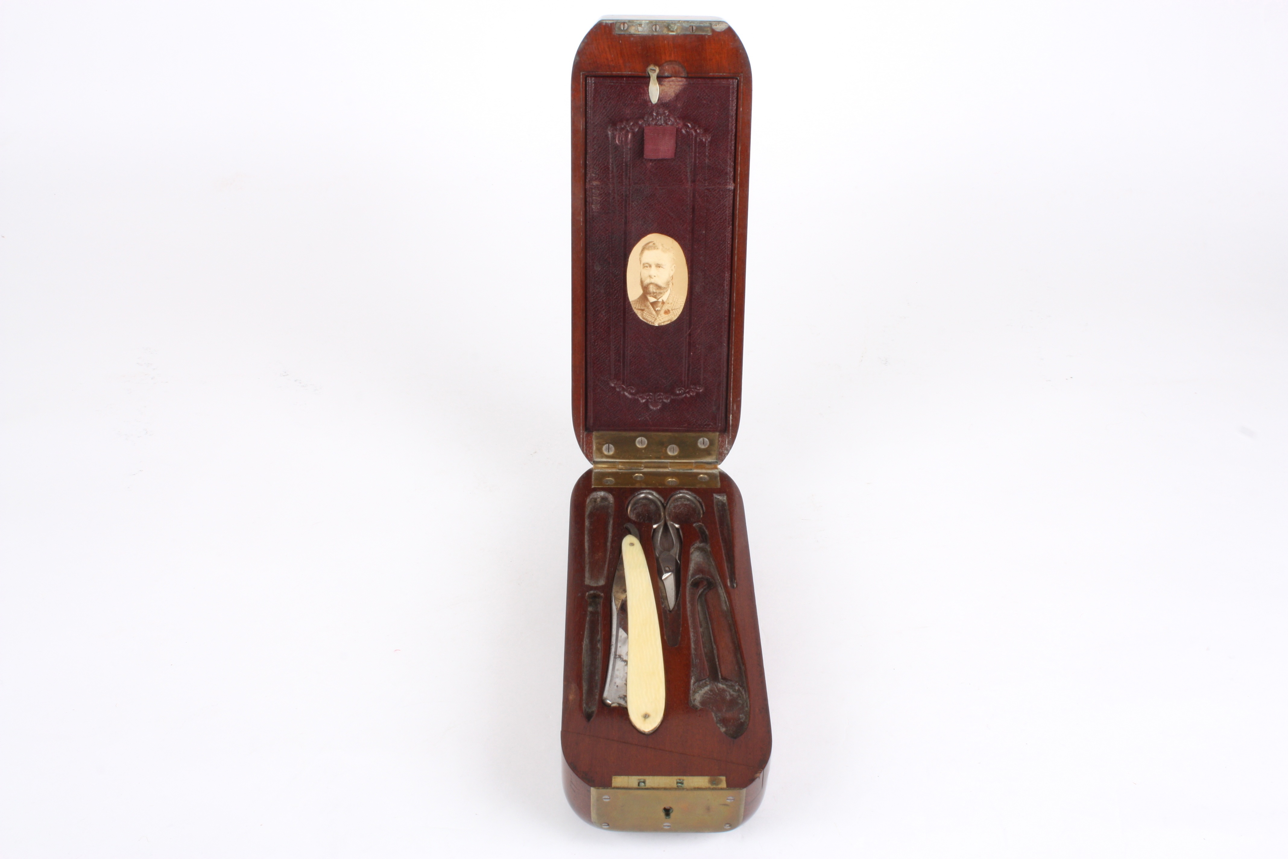 A gentleman's unusual 19th century mahogany cased travelling shaving set
the case of unusual shape - Image 3 of 3