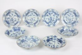 A set of eight 19th century Chinese blue and white bowlseach painted with a central panel of